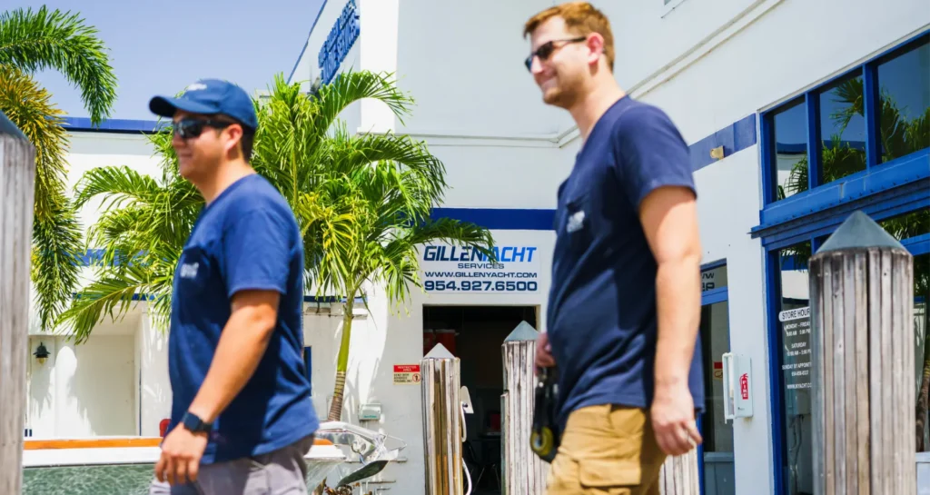 Two Gillen Yacht workers walking