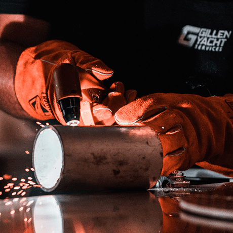 Worker using a welding tool