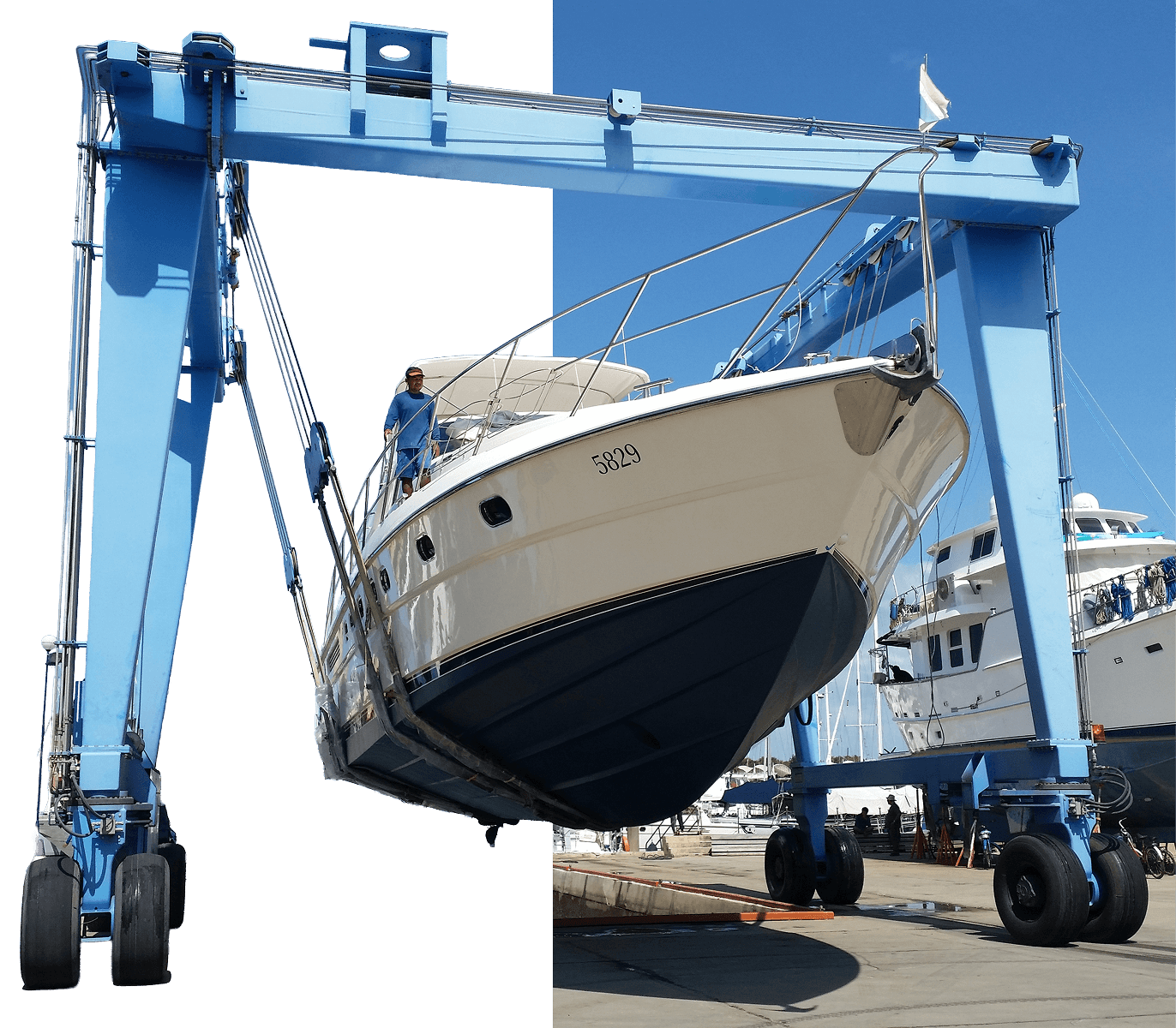 A yacht suspended in a marine travel lift during a haul-out